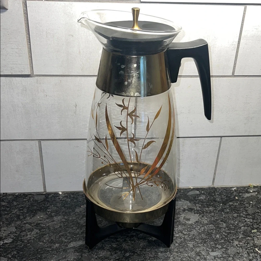Vintage Pyrex Coffee Carafe. Has tea light candle warmer stand included.